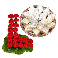 Send Rakhi Gift in India Carnation Basket, Kaju Burfi Sweets With Rakhi