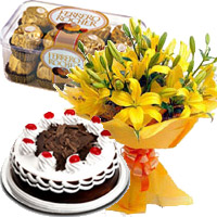12 Yellow Lily, 1/2 Kg Black Forest Cake, 16 Pcs Ferrero Rocher Bhai Dooj Gift to India