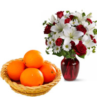 Buy 2 White Lily 6 White Gerbera 6 Red Roses Vase with 12 pcs Fresh Orange Basket Delivery in India