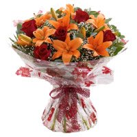 12 red roses and 4 orange lily Bunch flowers for Bhai Dooj
