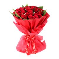 Online Red Rose Bouquet in Crepe 24 Flowers to India